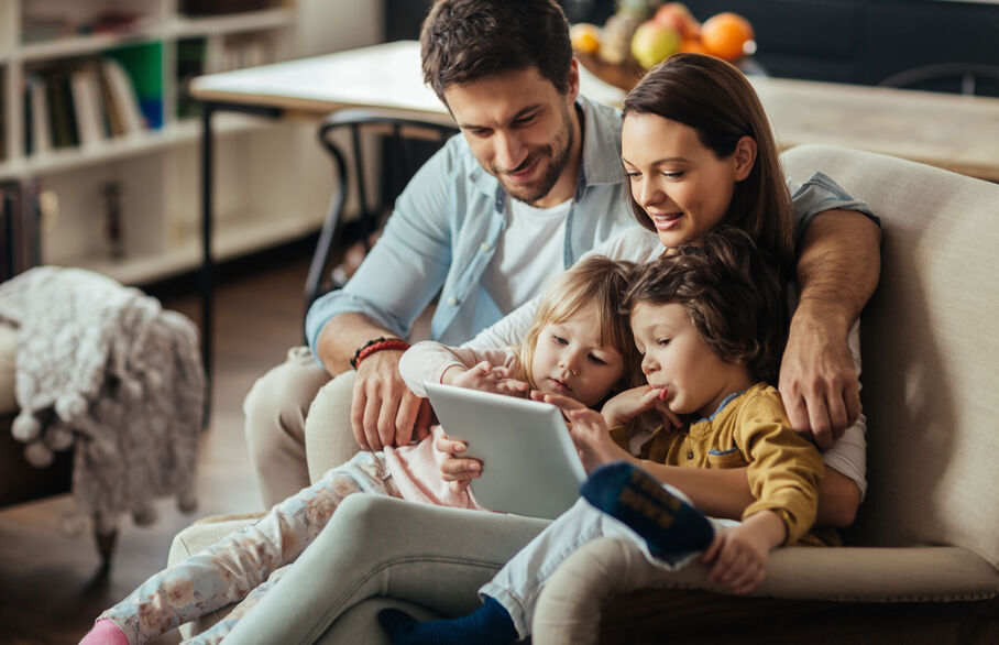 Family looking at a tablet computer